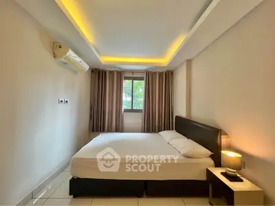 Cozy bedroom with modern lighting and air conditioning in a stylish apartment.