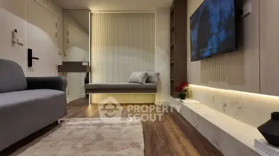 Modern living room with sleek design, cozy seating, and elegant decor