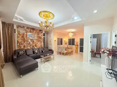 Luxurious living room with elegant chandelier and modern decor