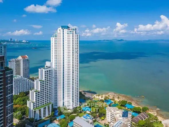 Stunning high-rise building with ocean view in a vibrant coastal cityscape.