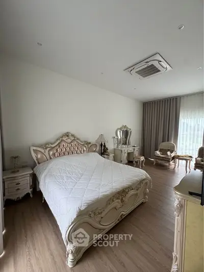 Luxurious bedroom with elegant furniture and natural light