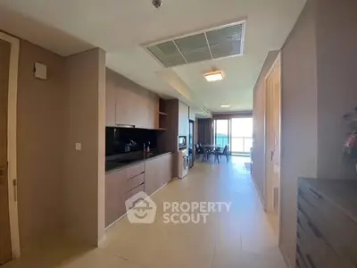 Spacious open-layout kitchen with modern appliances and a view of the living area.
