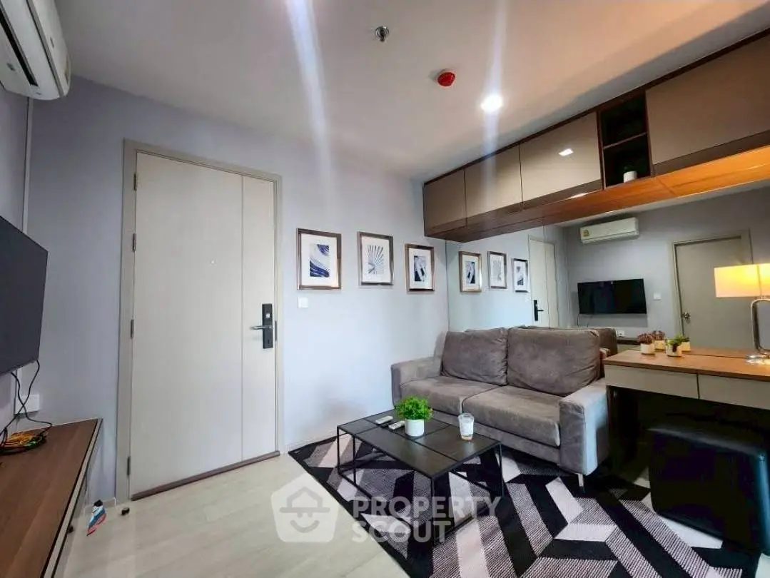 Modern living room with stylish decor and cozy seating area.