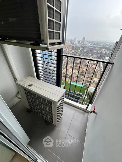 High-rise balcony with city view and air conditioning unit, perfect for urban living.