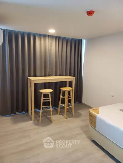 Modern bedroom with minimalist furniture and natural light