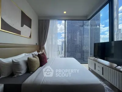 Luxurious bedroom with stunning city view and modern decor in high-rise apartment.