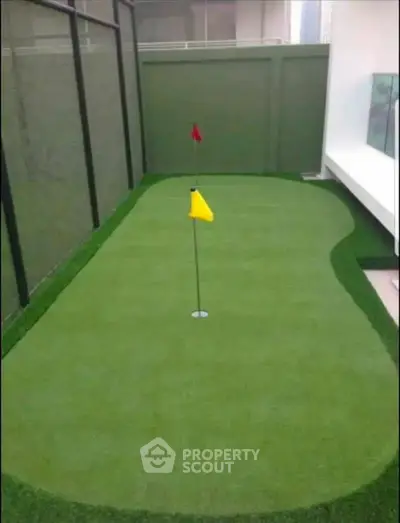 Luxurious private putting green in modern residential property, perfect for golf enthusiasts.