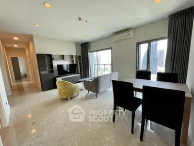Spacious modern living room with city view, elegant furniture, and natural light.