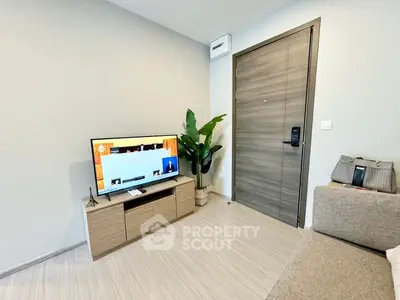 Modern living room with sleek design and smart TV, perfect for urban living.