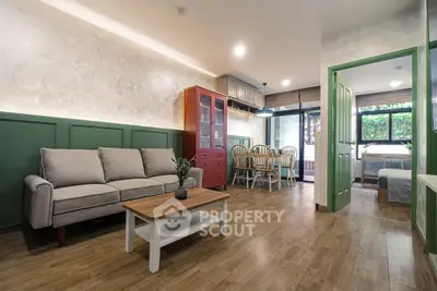 Charming living room with cozy sofa and dining area in stylish apartment