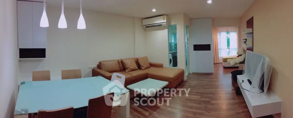 Modern living room with stylish furniture and open layout in a cozy apartment.