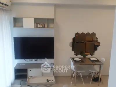 Modern living room with wall-mounted TV and stylish dining area