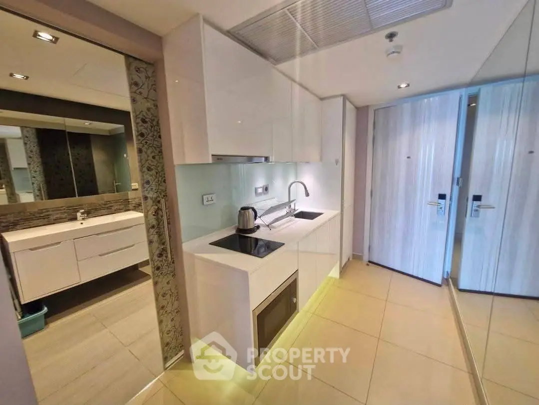 Modern compact kitchen with sleek design and integrated appliances