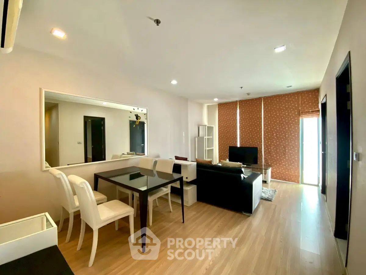 Spacious modern living room with elegant dining area and natural light