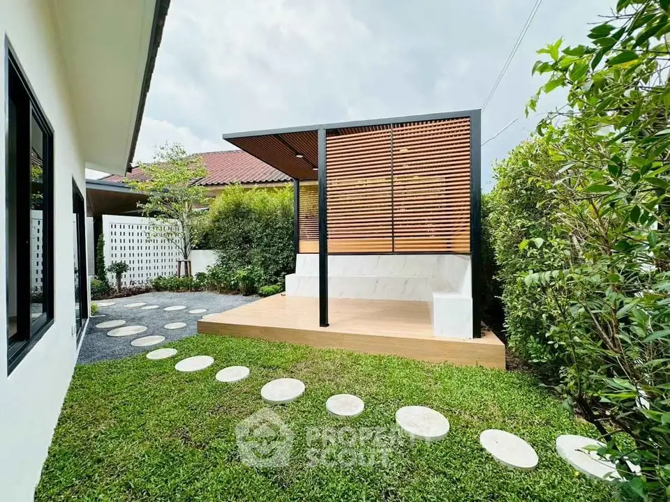 Modern backyard with stylish wooden pergola and lush green garden
