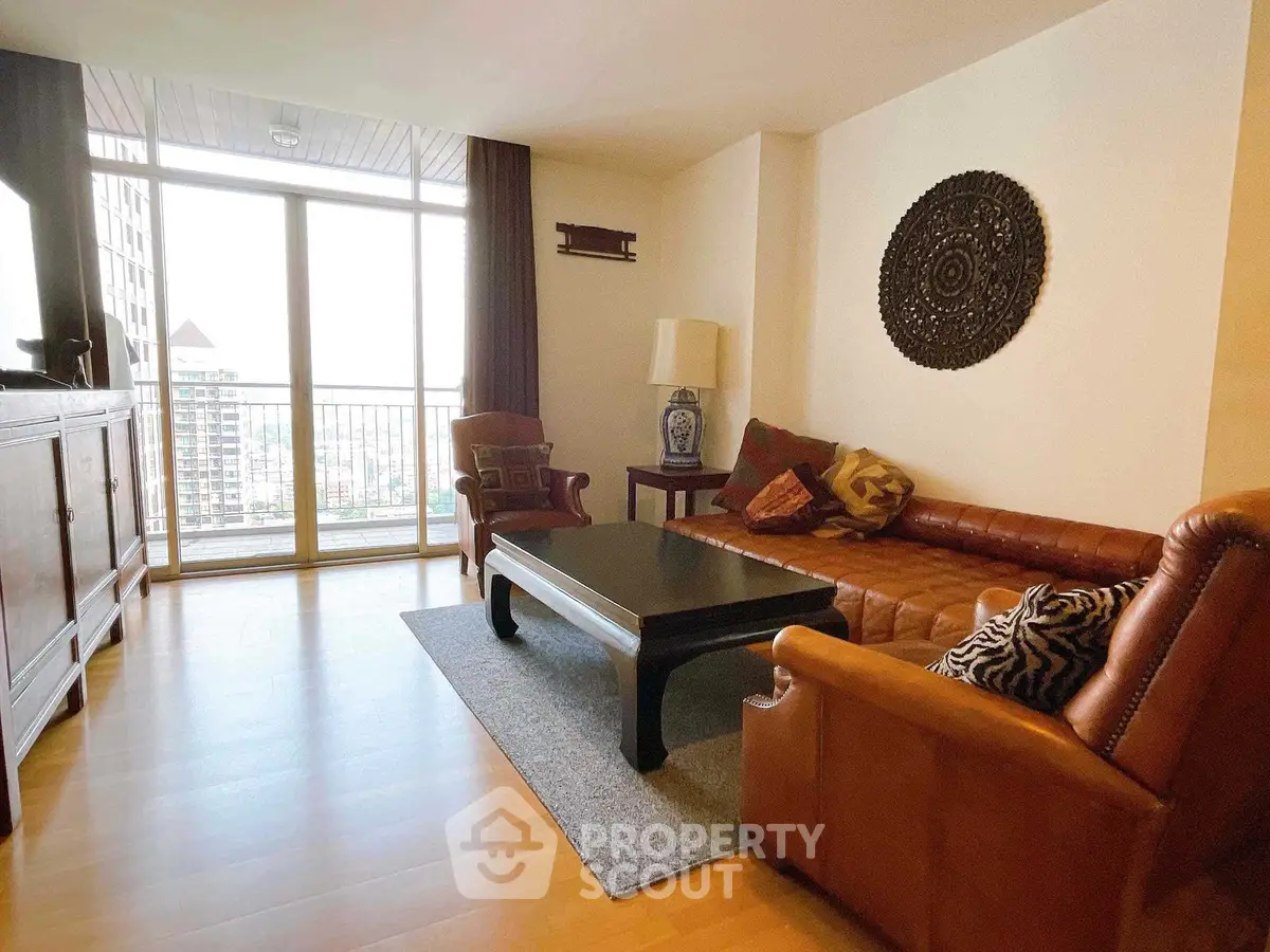 Spacious living room with elegant decor and city view balcony