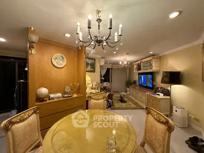 Elegant living room with classic chandelier and luxurious decor
