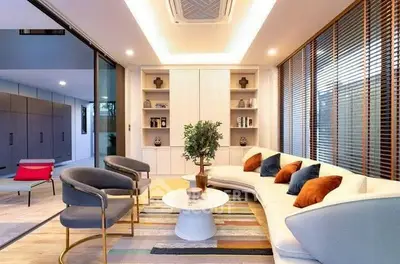 Modern living room with stylish furniture and large windows for natural light.