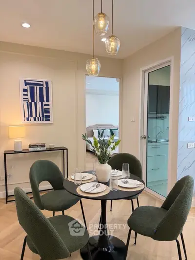 Stylish dining area with modern decor and cozy seating in a contemporary apartment.