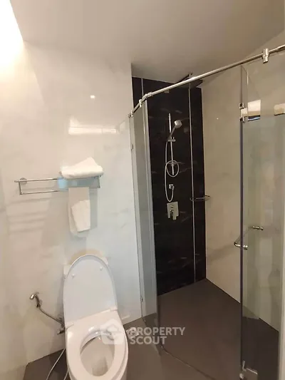 Modern bathroom with glass shower and sleek fixtures