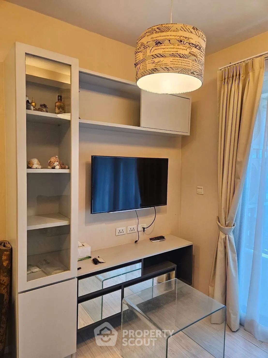 Modern living room with stylish decor and wall-mounted TV