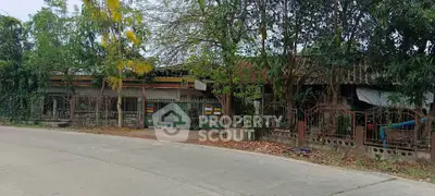 Charming rustic property with lush greenery and spacious outdoor area, perfect for nature lovers seeking tranquility.