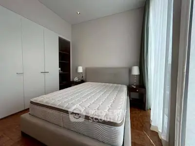 Spacious bedroom with elegant design and natural light