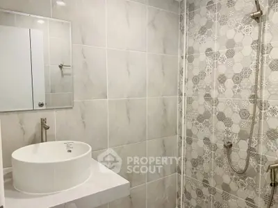 Modern bathroom with stylish tile design and sleek fixtures