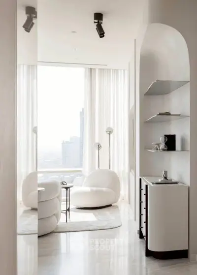 Luxurious modern living room with panoramic city view and elegant white furniture.