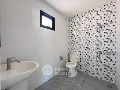 Modern bathroom with stylish tile design and sleek fixtures