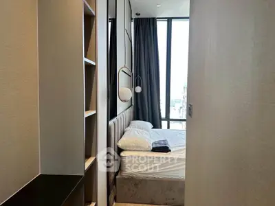 Modern bedroom with floor-to-ceiling windows and elegant decor in a high-rise apartment.
