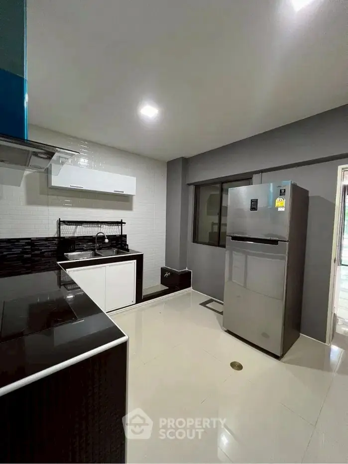 Modern kitchen with sleek appliances and minimalist design