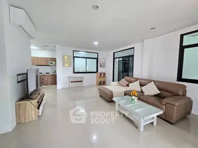 Spacious modern living room with open layout and stylish furniture
