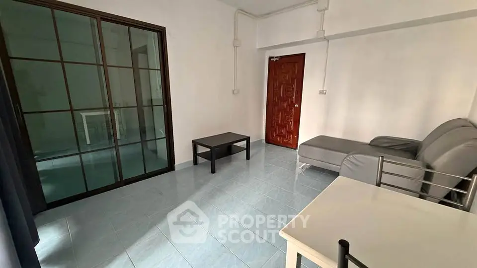 Spacious living room with modern furniture and sliding glass doors