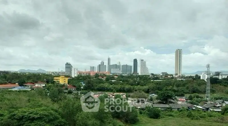 Stunning cityscape view with lush greenery and modern skyline, perfect for urban living enthusiasts.