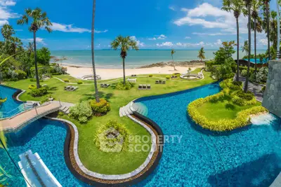 Luxurious beachfront property with stunning pool and lush gardens offering breathtaking ocean views.