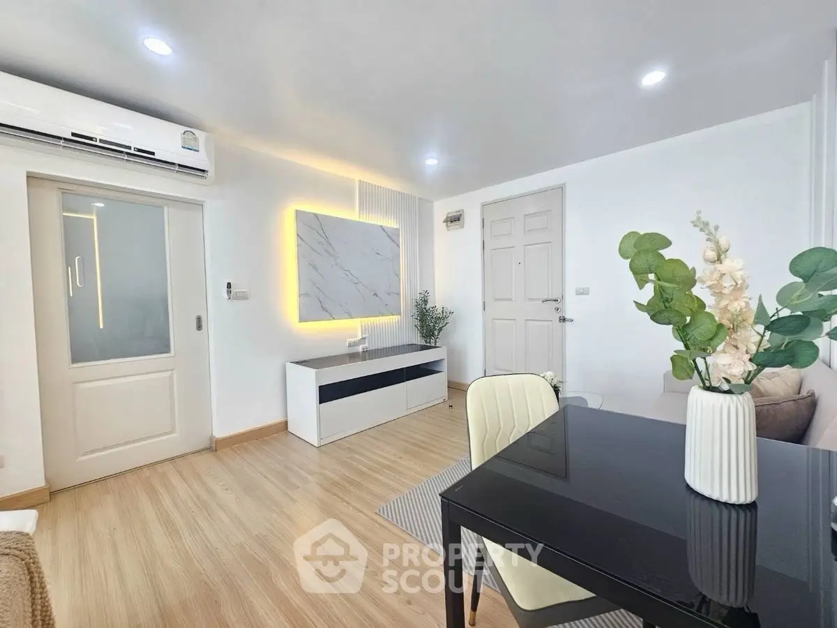 Modern living room with sleek decor and ambient lighting