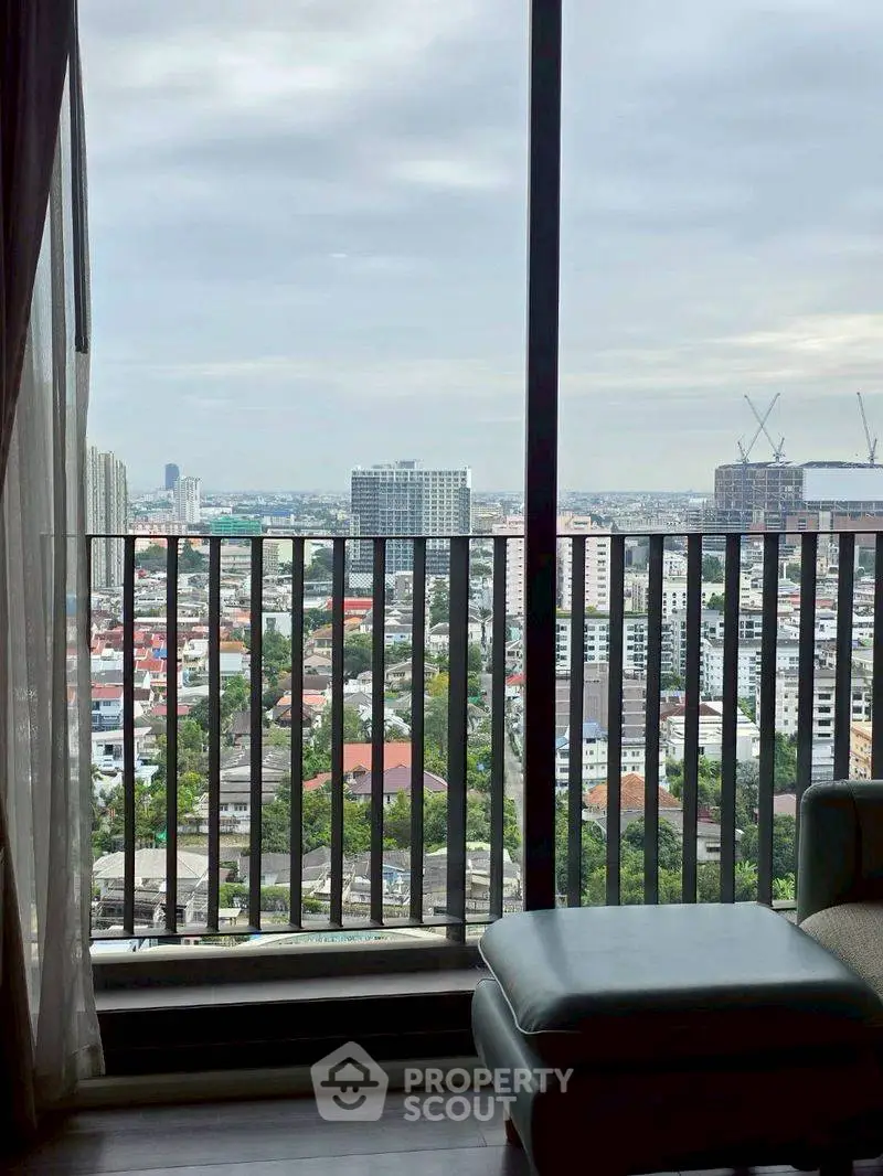 Stunning cityscape view from a high-rise apartment balcony, perfect for urban living.