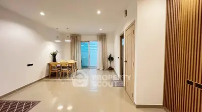 Spacious modern dining area with elegant lighting and sleek flooring