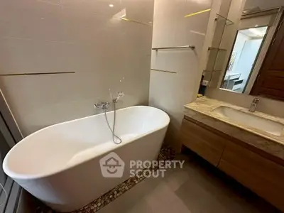 Elegant bathroom with modern freestanding bathtub and stylish vanity