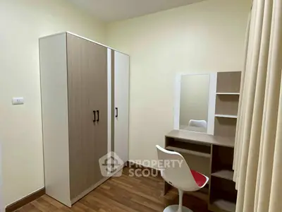 Modern study room with sleek desk and wardrobe in cozy apartment