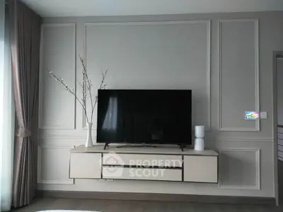 Modern living room with sleek TV setup and elegant decor