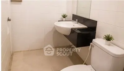 Modern bathroom with sleek fixtures and minimalist design, perfect for contemporary living.