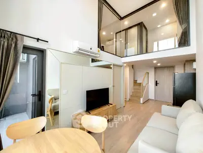 Modern duplex living room with stylish furniture and open layout