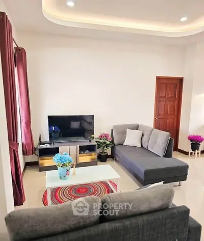 Modern living room with stylish furniture and vibrant decor, perfect for relaxation and entertainment.