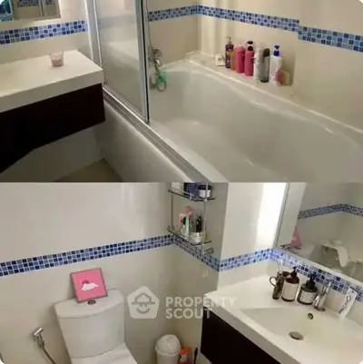 Modern bathroom with sleek fixtures and bathtub, featuring stylish blue tile accents.