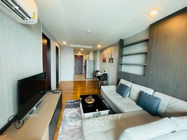 Modern living room with sleek furniture and stylish decor in a contemporary apartment.