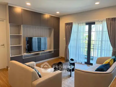 Modern living room with stylish furniture and large window for natural light