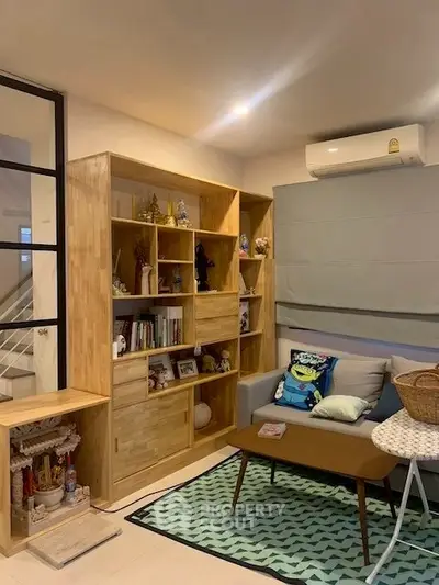 Cozy living room with wooden shelving and modern decor
