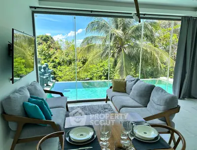 Luxurious living room with stunning pool and garden view, perfect for relaxation and entertaining.
